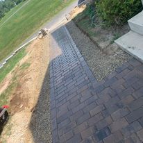 New paver walkway beside a house
