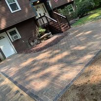 Paver patio at the back of a house