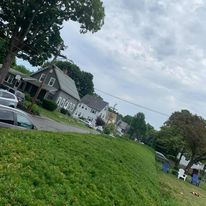 Freshly mowed corner-lot lawn
