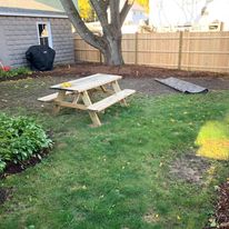 Backyard lawn with a picnic table