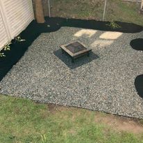 Gravel patio with a fire pit