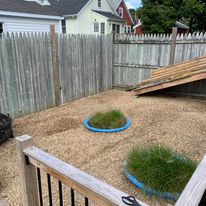 Gravel courtyard with round planters