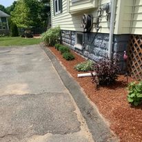 Mulched bed along a driveway