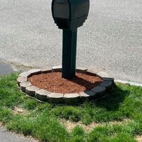 Mulch ring around a mailbox post