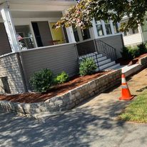 Block-edged mulch bed by the front steps