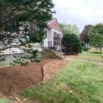 New bed edging in front of a house