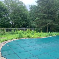 Yard work around a covered pool