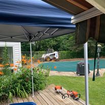 Pool deck with shade canopy and planters
