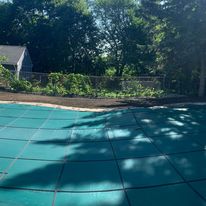 Covered pool with surrounding lawn
