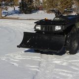 Plowing a snowy driveway