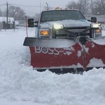 Plow truck clearing snow